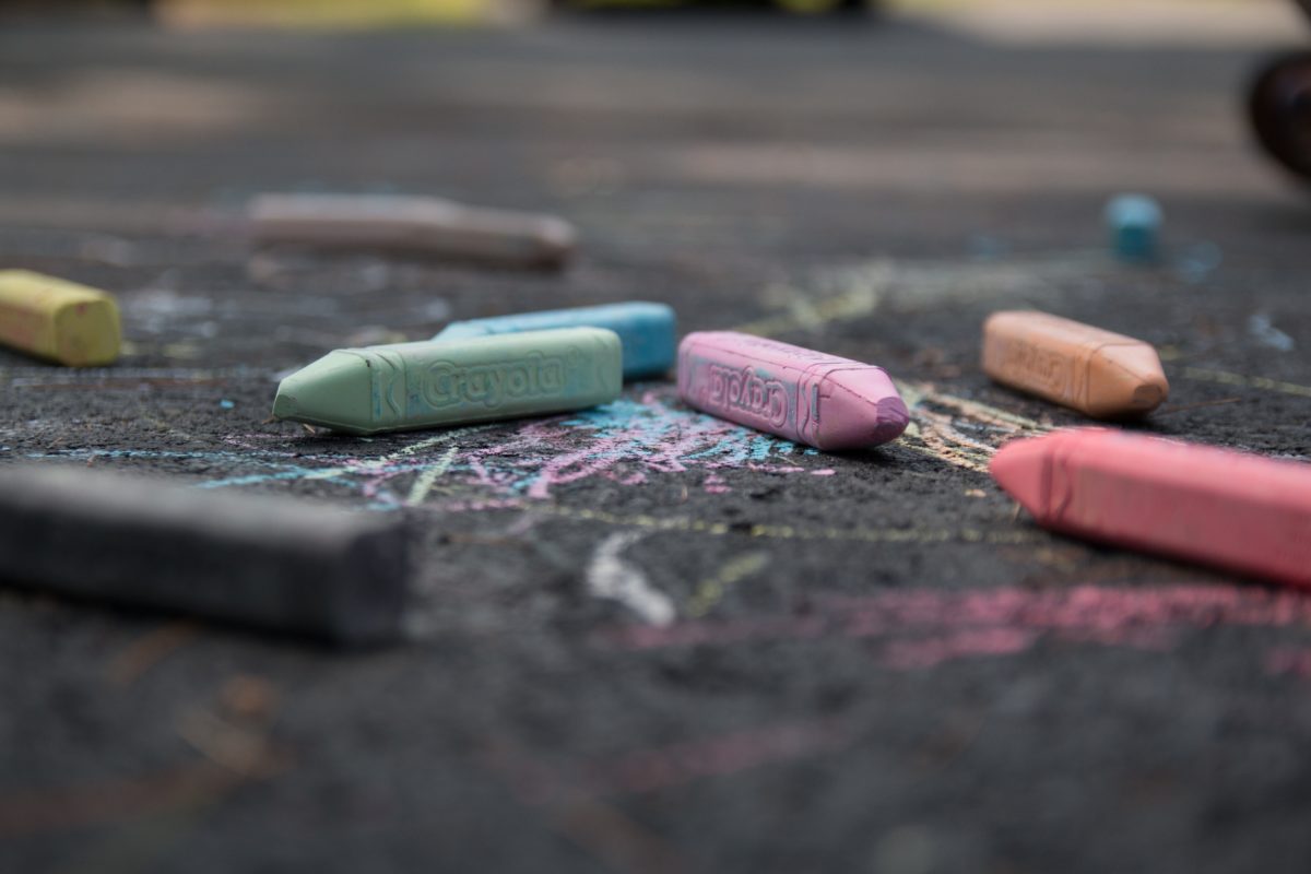 colored chalk pieces on pavement
