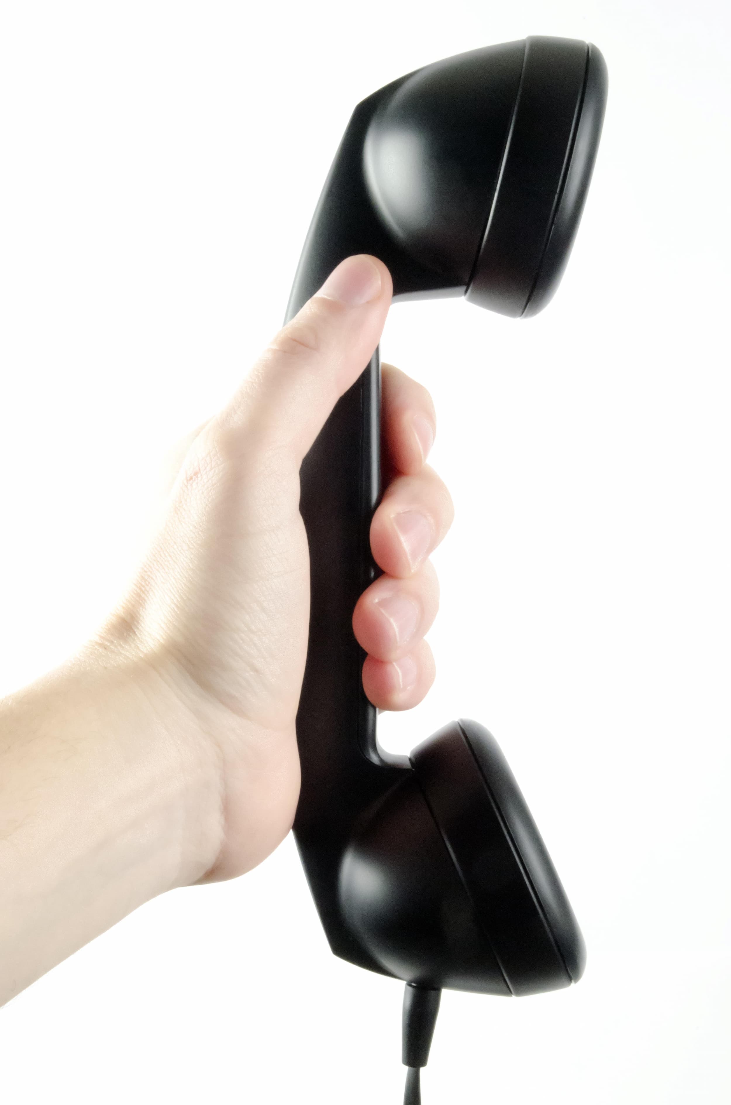 Hand holding a telephone