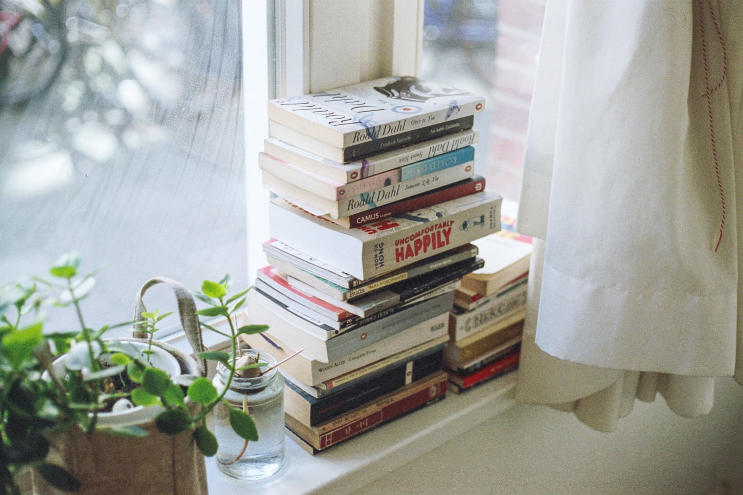 book pile on window sill