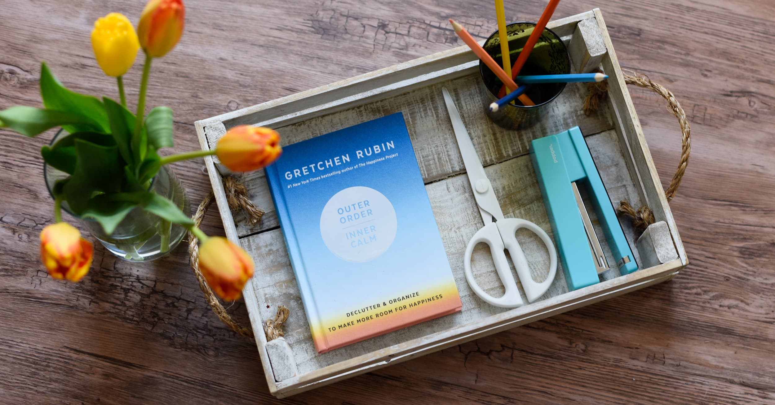 Outer Order Inner Calm book on a wooden tray with offie supplies