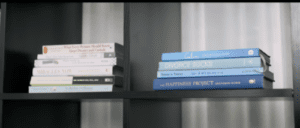 Bookcase with stacks of books