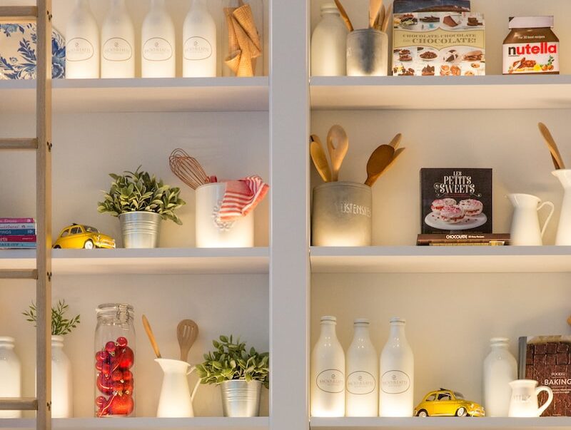 white ceramic bottles on shelf