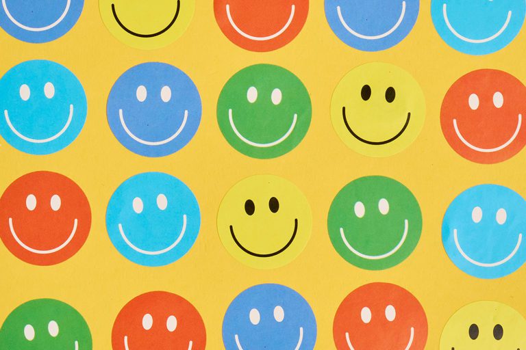 Smiley Faces on yellow background