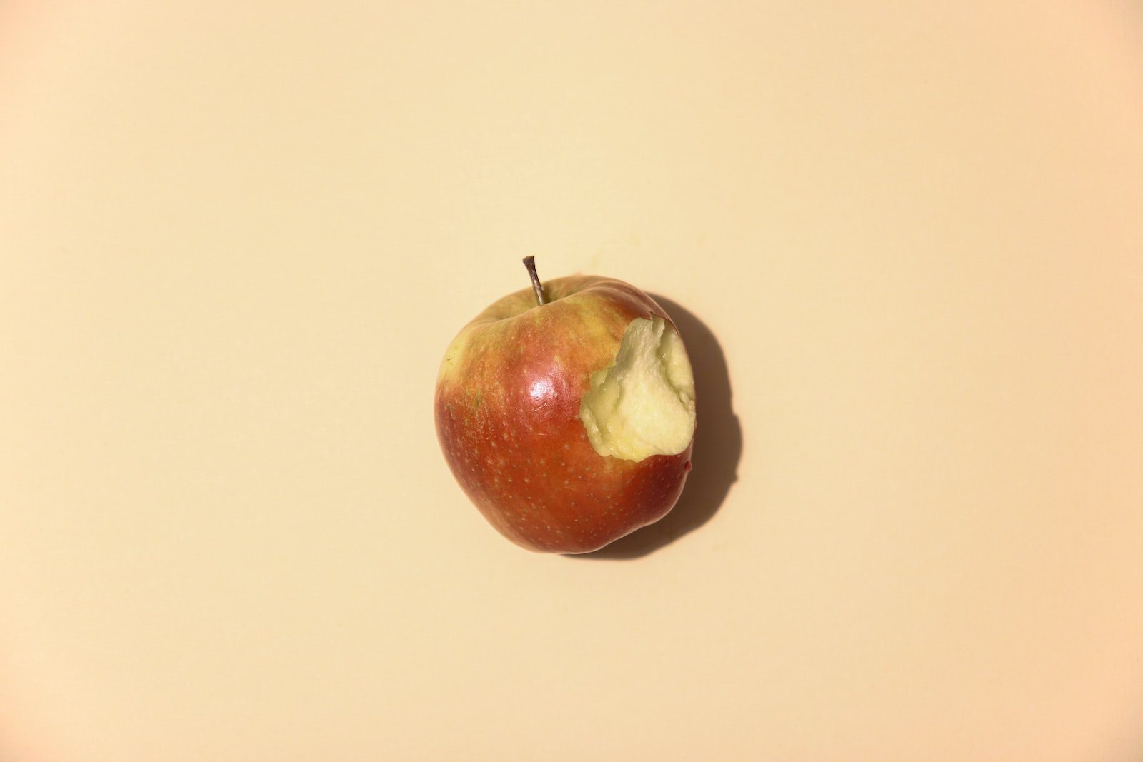 red apple fruit on white table